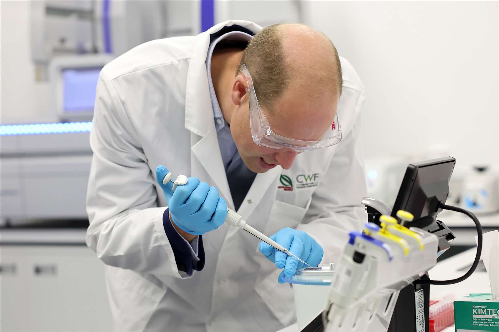 William uses forensic equipment as he performs DNA sequencing tests (Chris Jackson/PA)
