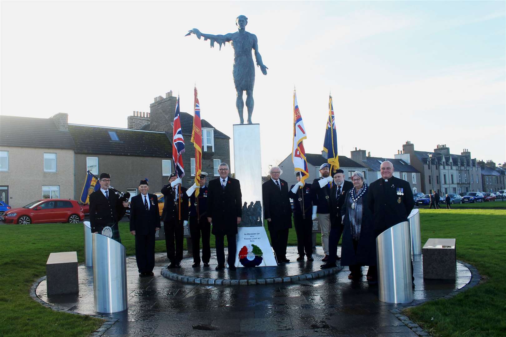Willie Watt (centre, left), Kevin Stewart (right) and others who took part in the ceremony at the Seafarers Memorial on Remembrance Sunday. Picture: Alan Hendry