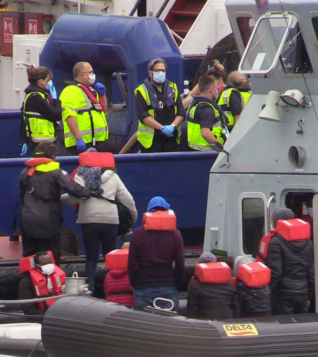 A group of people thought to be migrants are brought into Dover, Kent, by Border Force officers following a small boat incident in the Channel (Michael Drummond/PA)