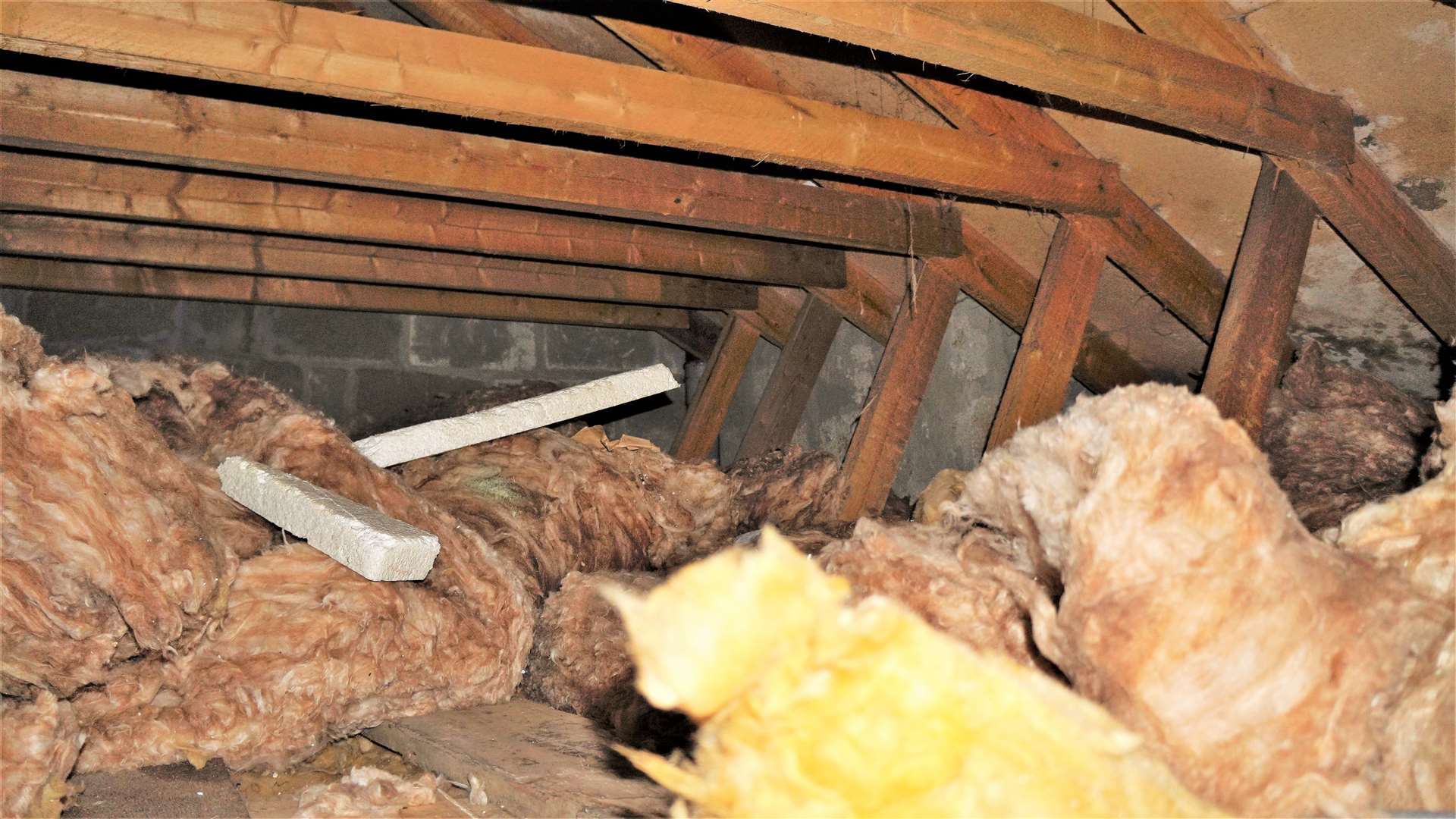 Insulation material in David Lightfoot's loft space that he says is 'thrown up' and not helping maintain optimum heat in the property.