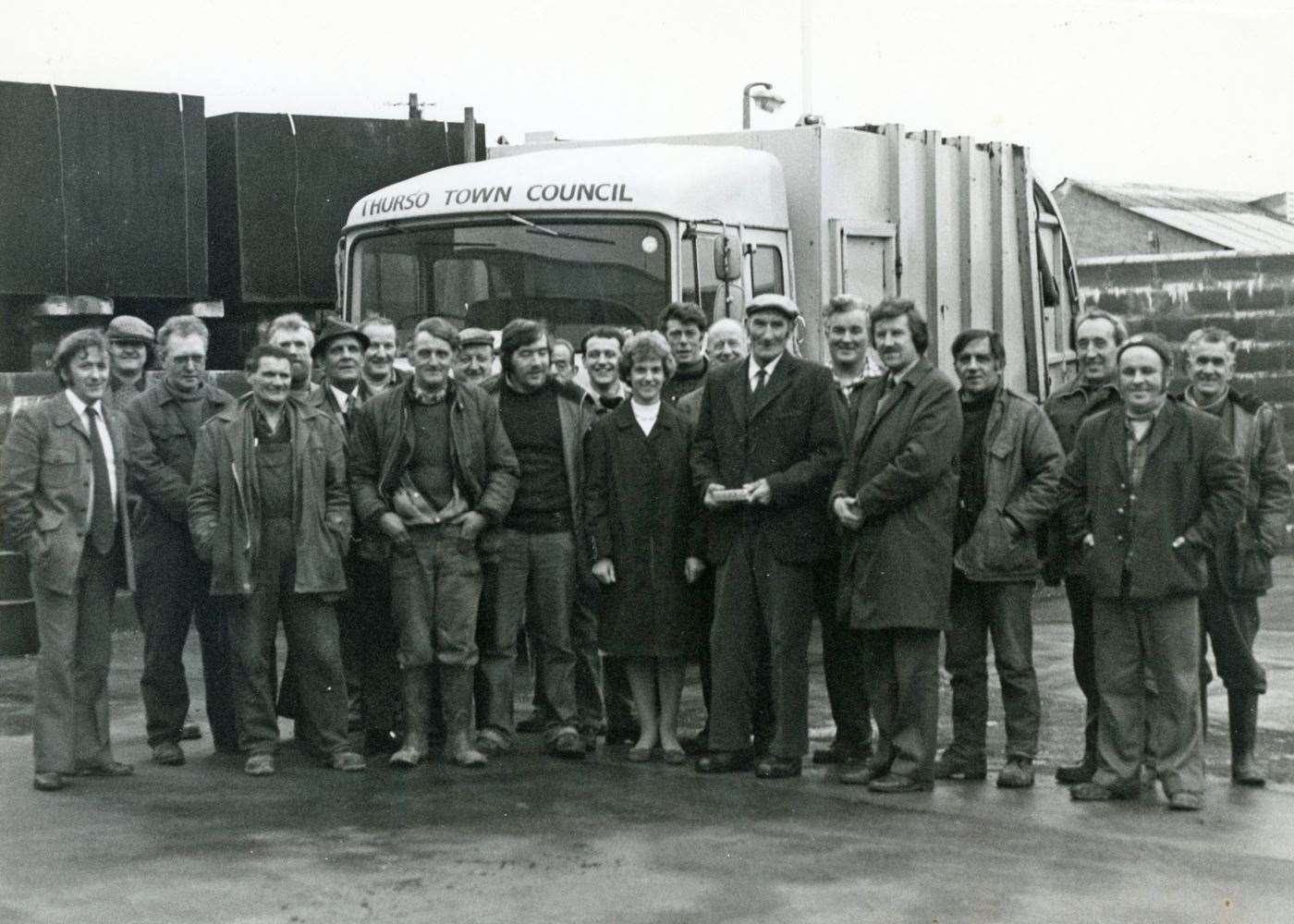 A photograph taken on the occasion of Jock Smith’s retirement featuring the Thurso binmen plus other council staff.