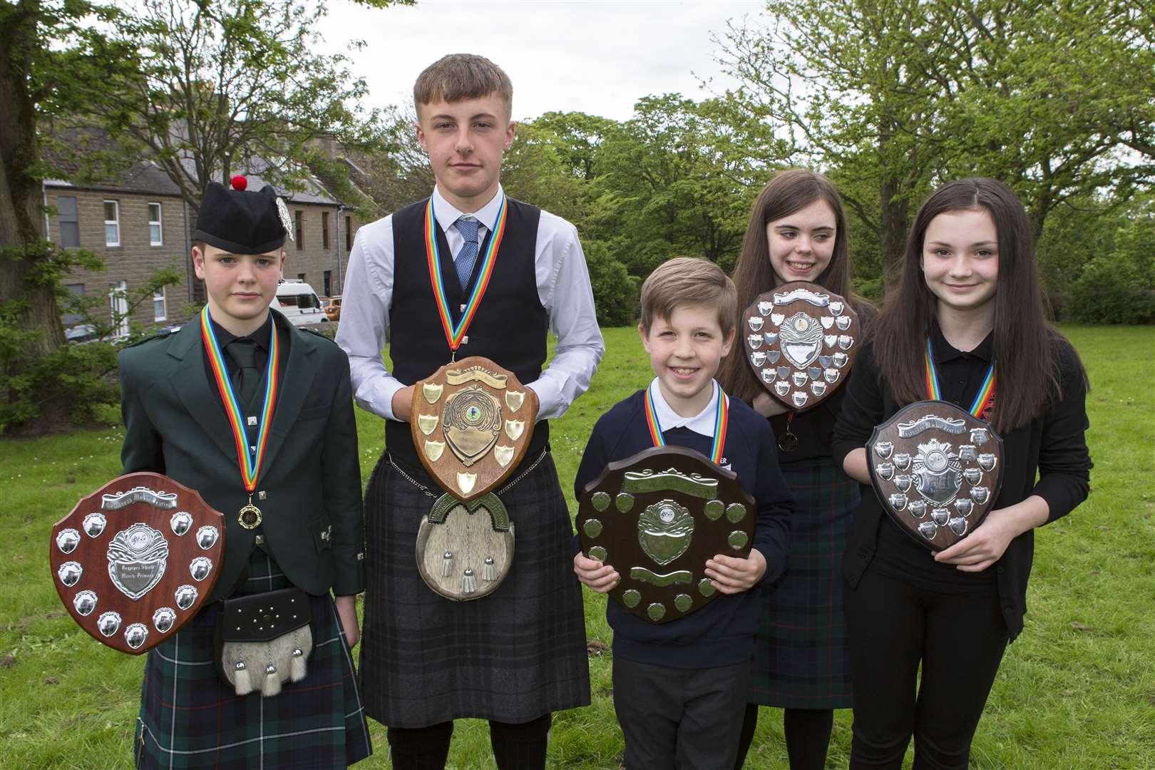 Bagpipe and chanter trophy winners, from left, Glenn Miller, Watten, won the Bagpipes Shield March Primary, Camie Clark, Barrock, Bagpipes Shield Strathspey and Reel, Andrew Sinclair, Latheron, Practice Chanter Shield Primary, Anna McGee, Bettyhill, Piping Challenge Shield March, and Louisa Donn, Thurso, Practice Chanter Shield Secondary. Picture: Robert MacDonald / Northern Studios