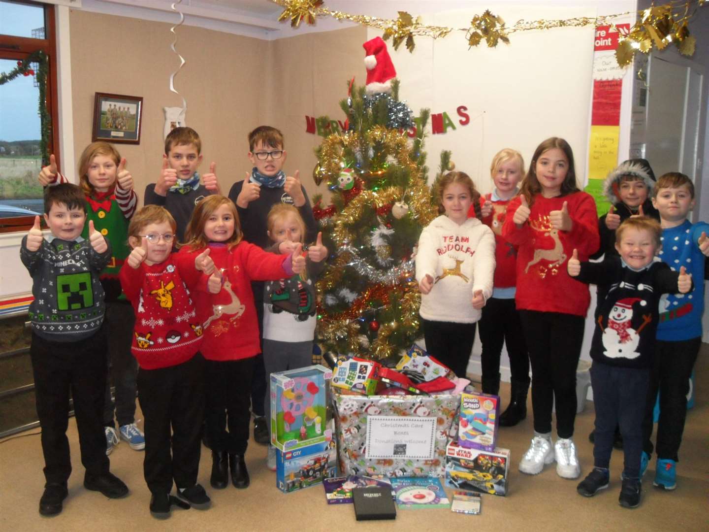 Bower Primary School children with gifts they have gathered for Thurso Community Café to help people less fortunate than themselves.