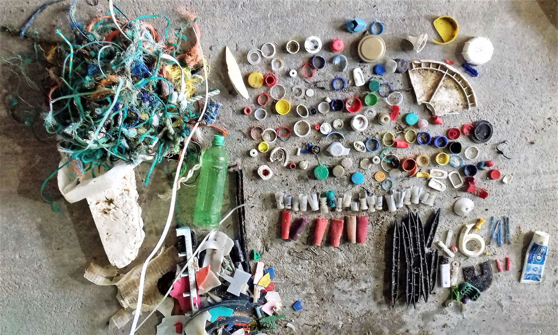An array of colourful plastic taken from Dunnet beach by the group in its early days. There is much less plastic debris on the beach now.