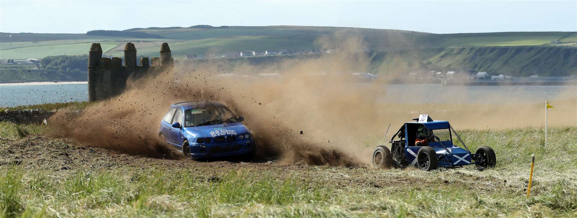 Jake Anderson (MG ZR) tries to catch up with Mark Foubister in his special buggy with Harold's Tower in the background. Picture: James Gunn