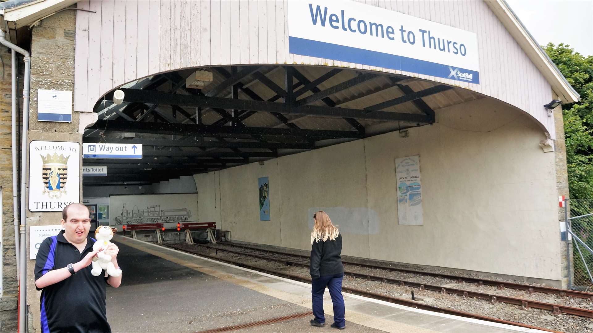People waiting for a train at Thurso station before lockdown.