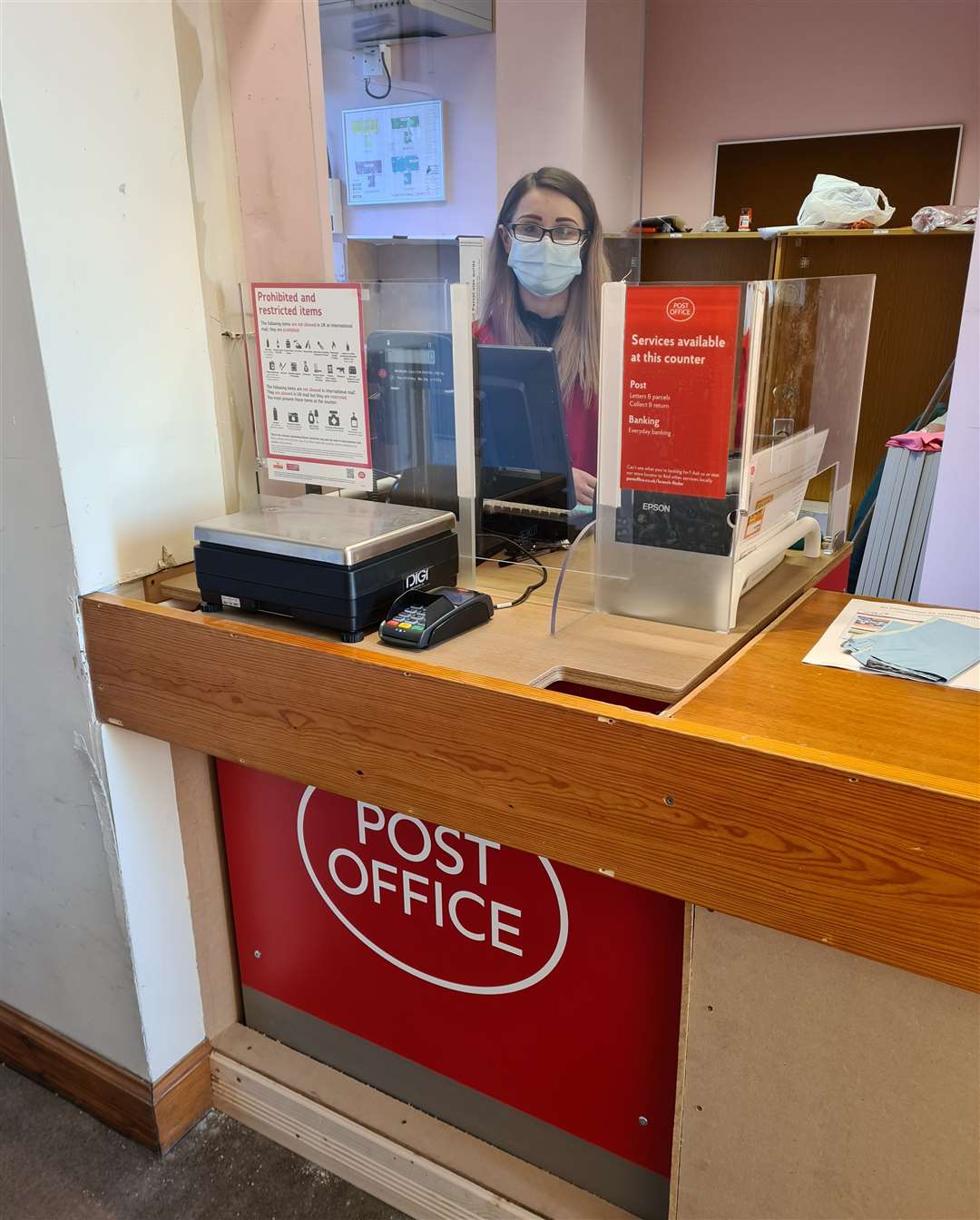 Sarah Bartholomew at the counter of the new Wick post office at 125-127 High Street.