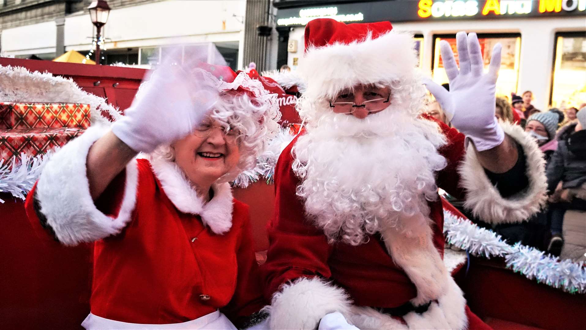 Santa and Mrs Claus wave to the many people who turned up on Saturday afternoon. Picture: DGS