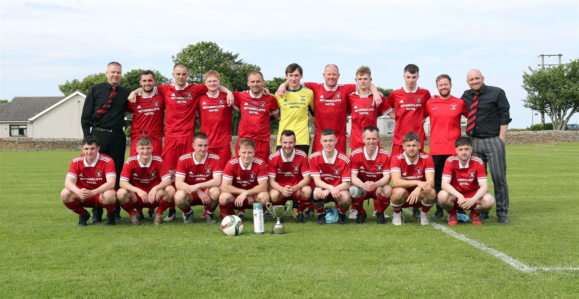 The victorious Wick Groats players and management team with the Colin Macleod Memorial Cup at Back Park, Castletown. Picture: James Gunn