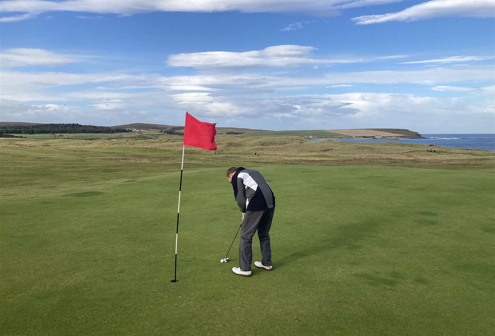 Murdo Macdonald, winner of round three of the North Point Distillery Senior Stableford, putting on the 10th hole.