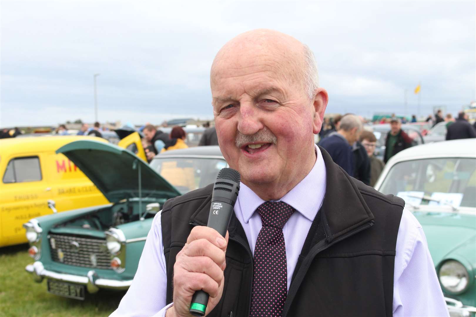 Willie Mackay is a familiar sight as compere at community events – in this case Caithness and Sutherland Vintage and Classic Vehicle Club's 50th anniversary rally at John O'Groats last summer. Picture: Alan Hendry