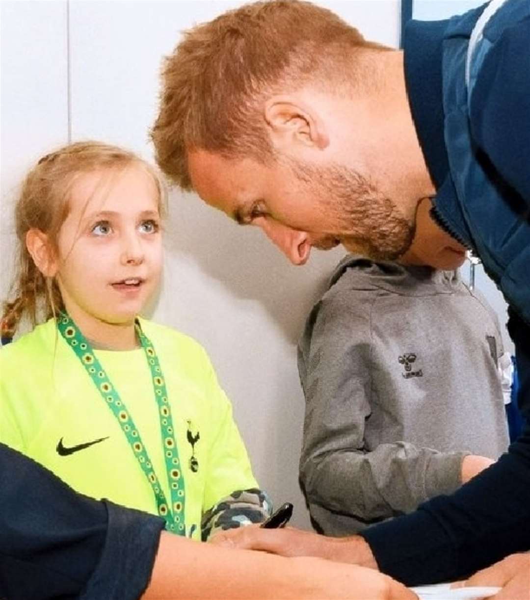 Caitlin Passey with footballer Harry Kane (Nick Passey/PA)