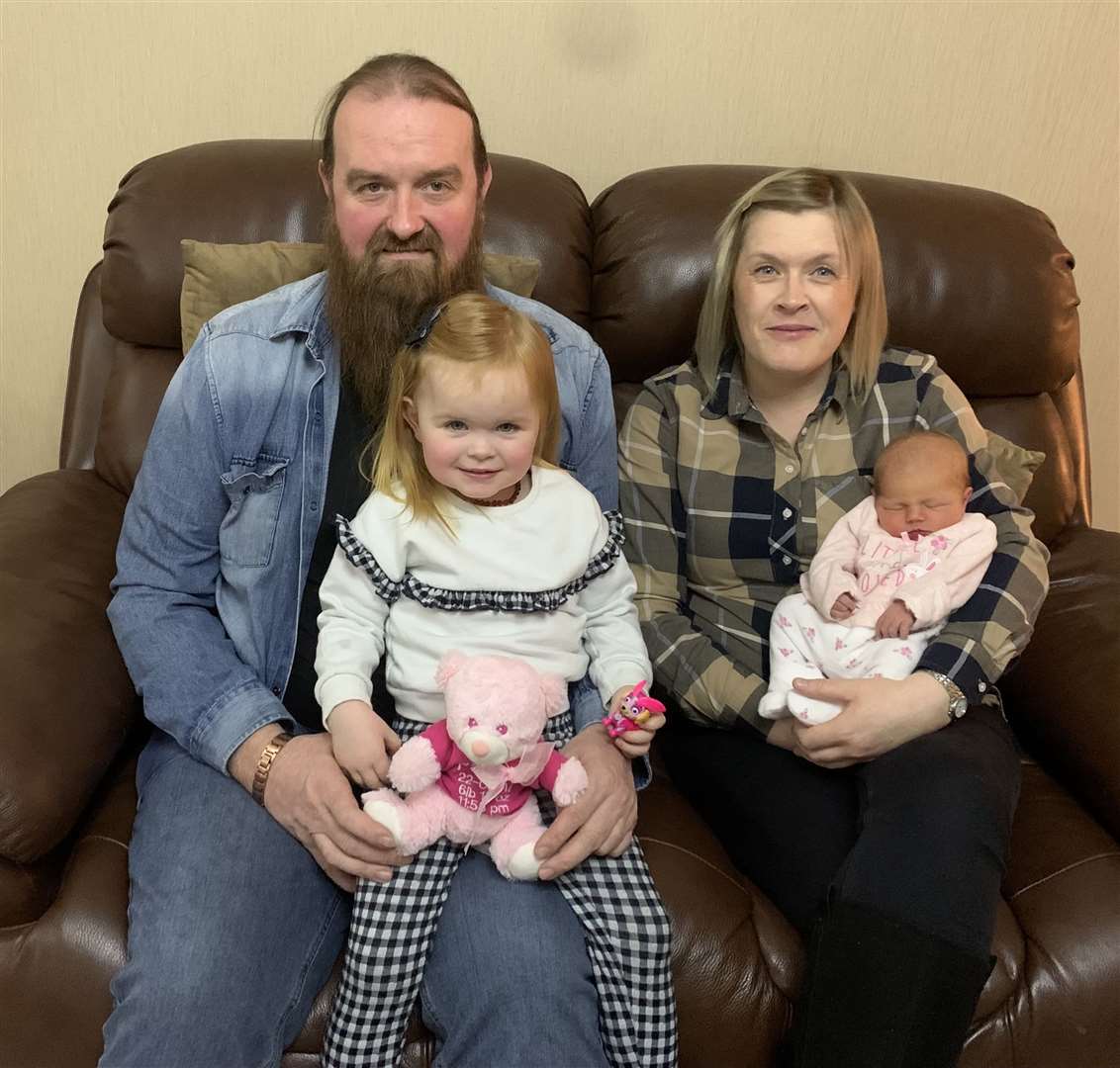 New Year's Day baby Remi safely at home in Newton Row, Wick, with her mum Gail Mackay, dad Gordie MacDonald and sister Paisley.
