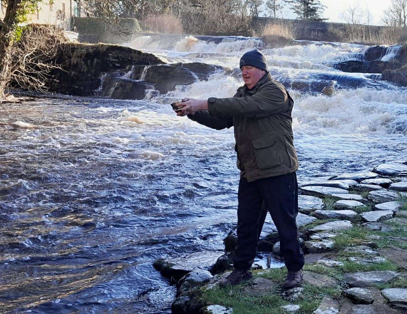 Charlie Ross from Wolfburn Distillery toasting the river.