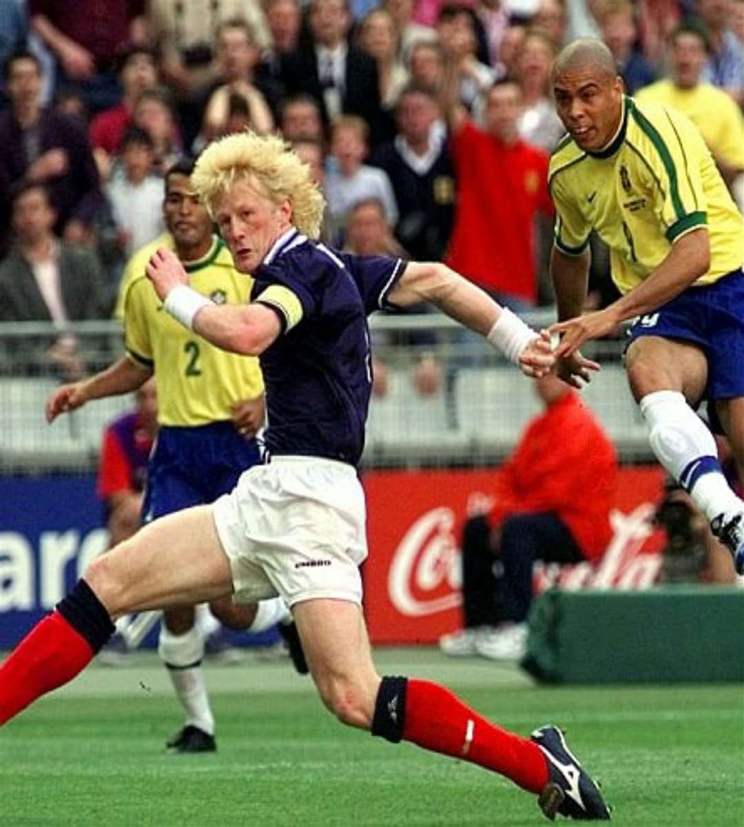 Colin Hendry in World Cup action for Scotland in 1998, coming up against Brazil's Ronaldo.