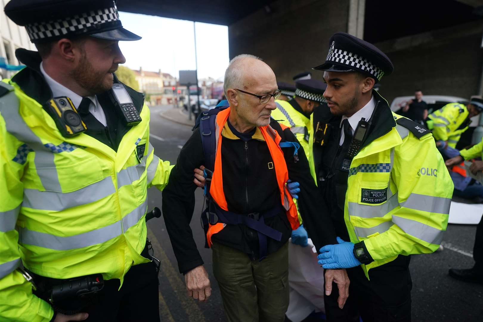 Police remove an Insulate Britain protester (Victoria Jones/PA)