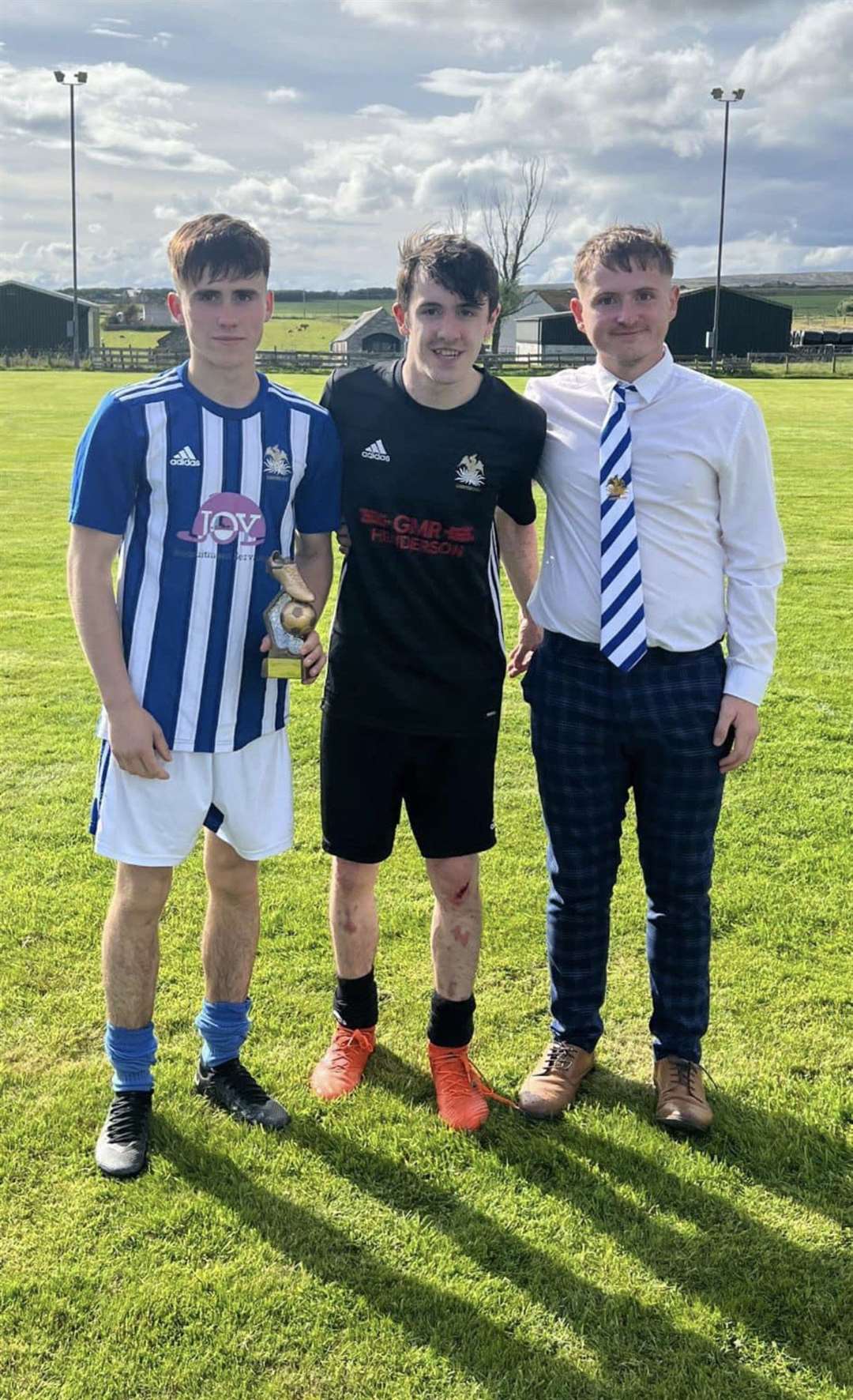 The trophy for most entertaining player went to Lybster's Ross Steven (left), with Stefan's younger brother Andrew Sutherland (centre) and Lybster manager Cameron Mackenzie.