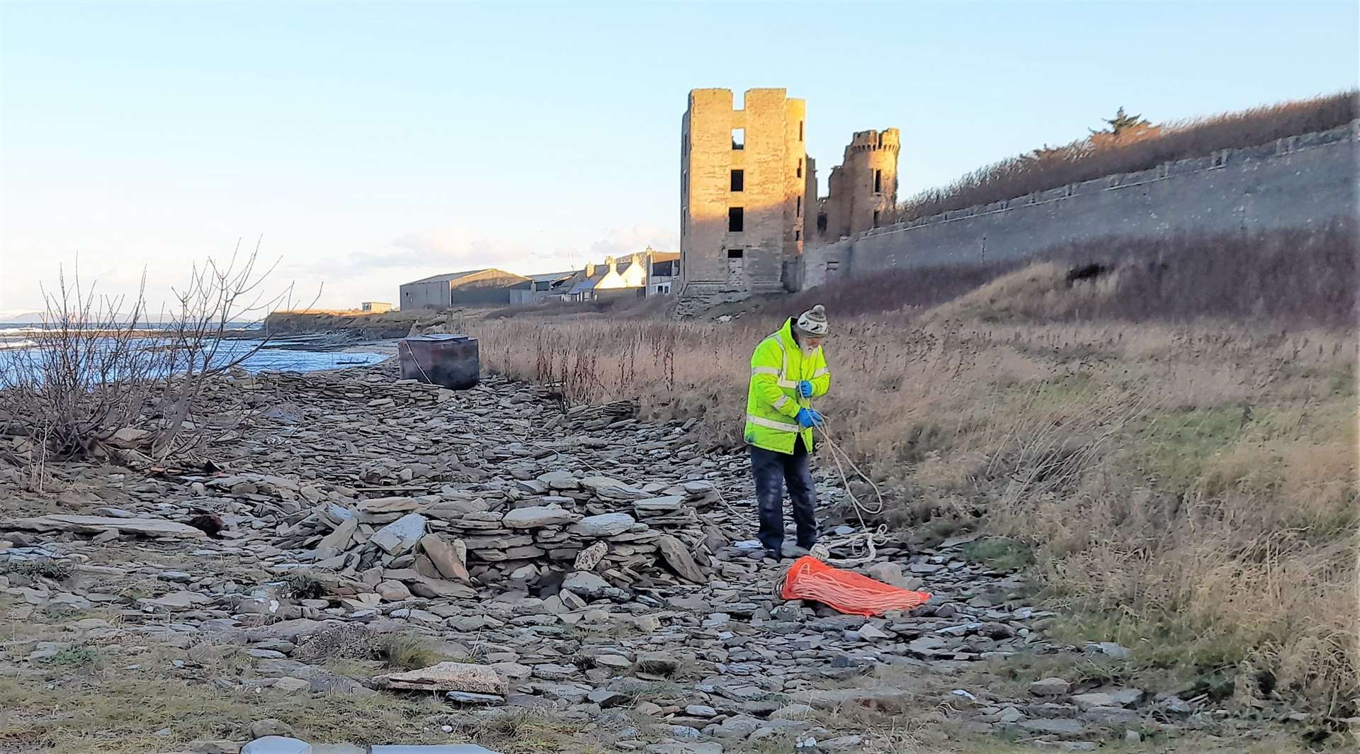 Allan Sinclair gets to grips with a large amount of coastal debris that had piled up. Pictures: Dorcas Sinclair