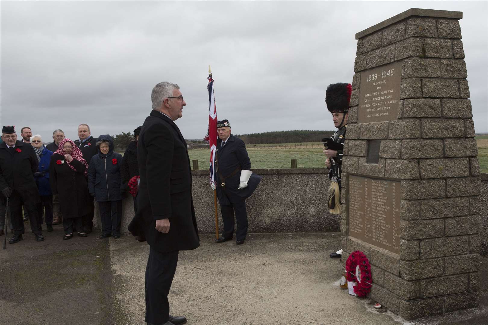 Willie Watt, Caithness Vice-Lieutenant, reflects for a moment after laying a poppy wreath at the Skitten airfield memorial. Picture: Robert MacDonald/Northern Studios