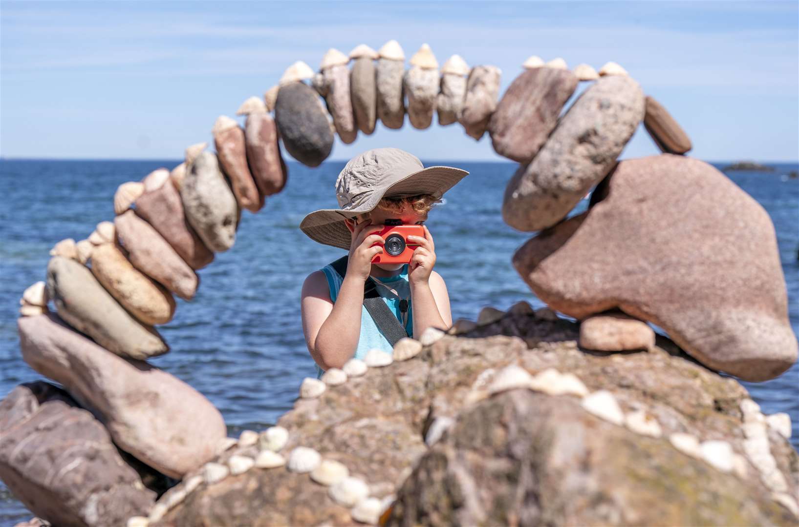 Angus Badenhorst, five, took a photograph of one of the amazing stone arches created during the European Stone Stacking Championships at Dunbar, East Lothian, in July (Jane Barlow/PA)