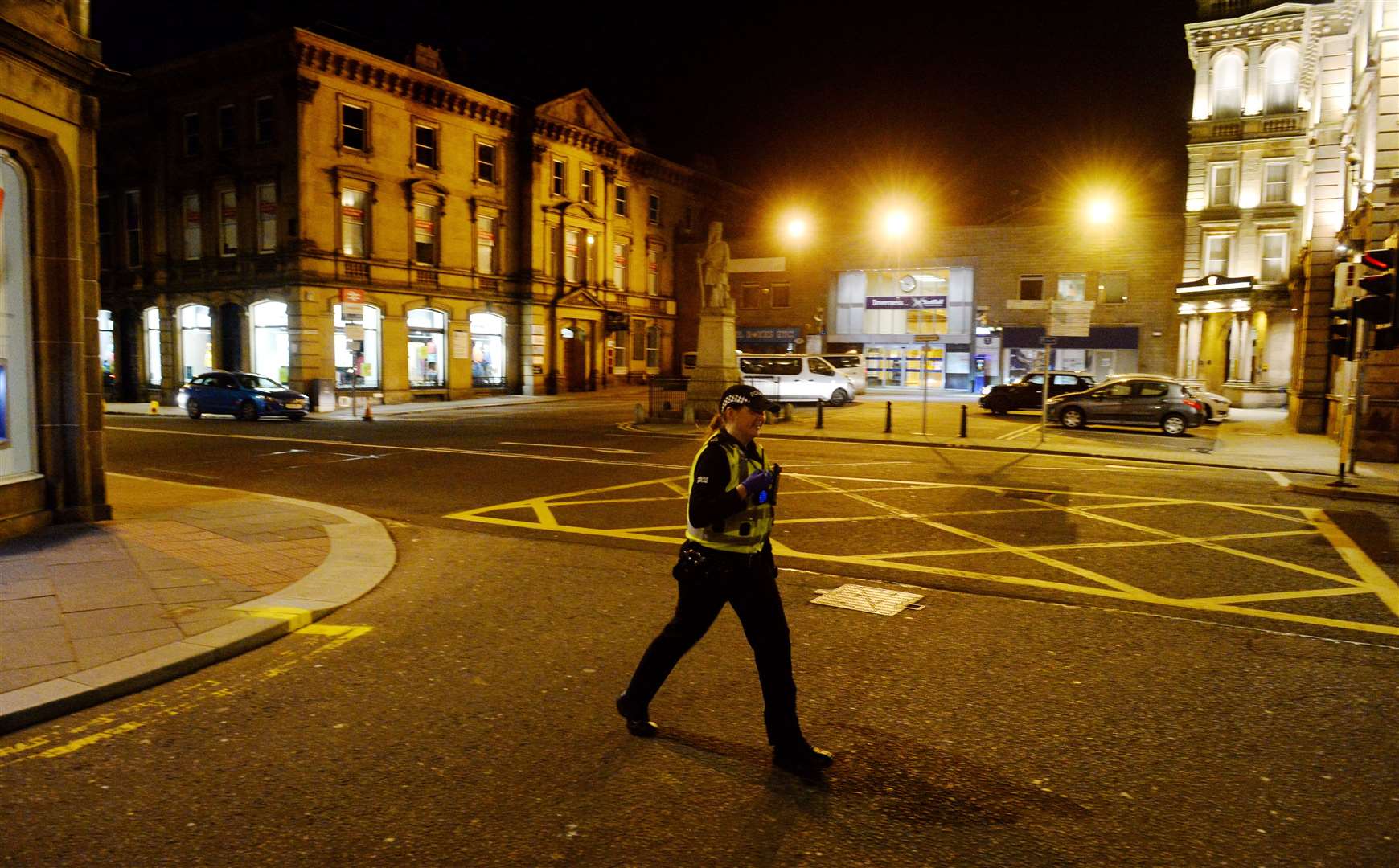 A police officer in Inverness city centre on the first Saturday night after pubs and clubs were shut down. Picture: Gary Anthony