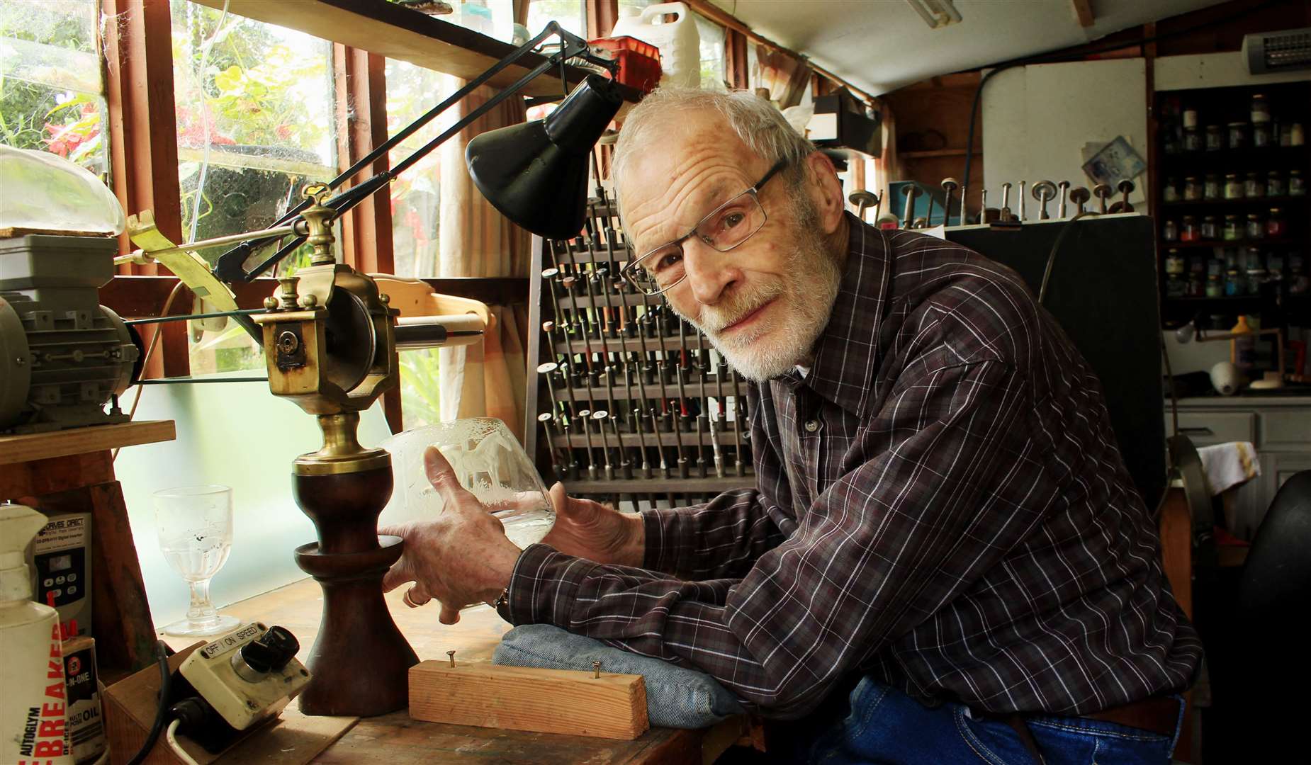 Glass artist Denis Mann in his workshop in Wick. Picture: Alan Hendry