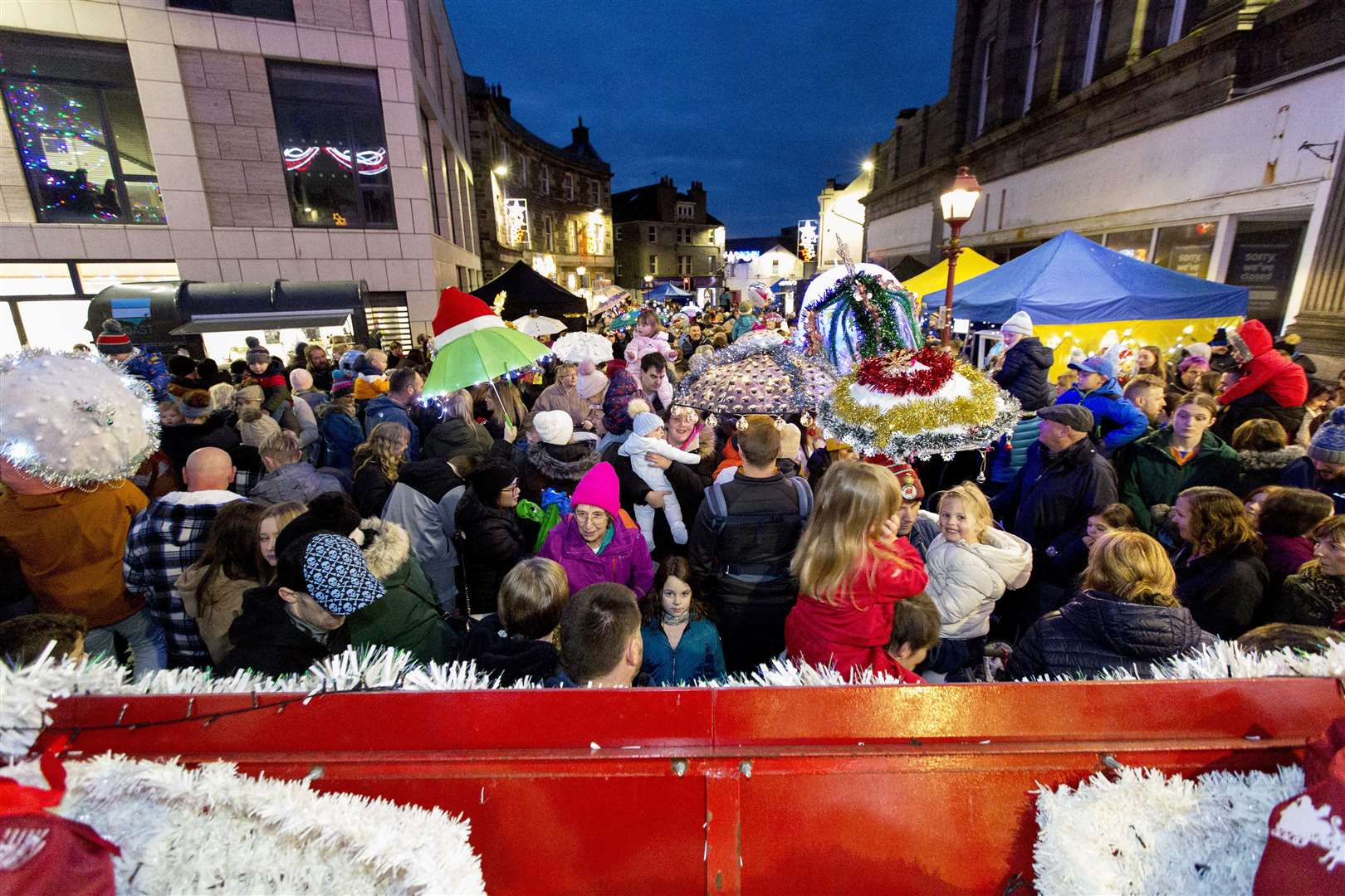 A sea of umbrellas mixing with the crowds in Wick town centre following the switch-on of the Christmas lights. Picture: Robert MacDonald / Northern Studios