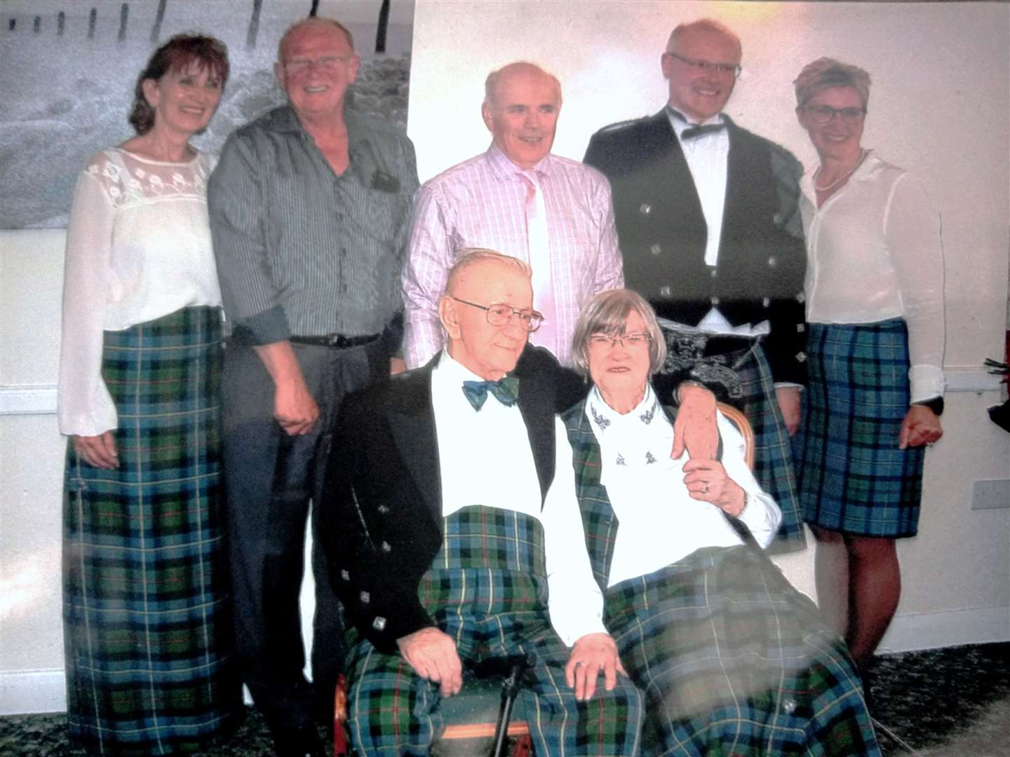 Marcus and his wife Dorothy seated in front of his son Ian, two nephews, one from Weymouth and the other from Australia, and his Norwegian grand-nieces.