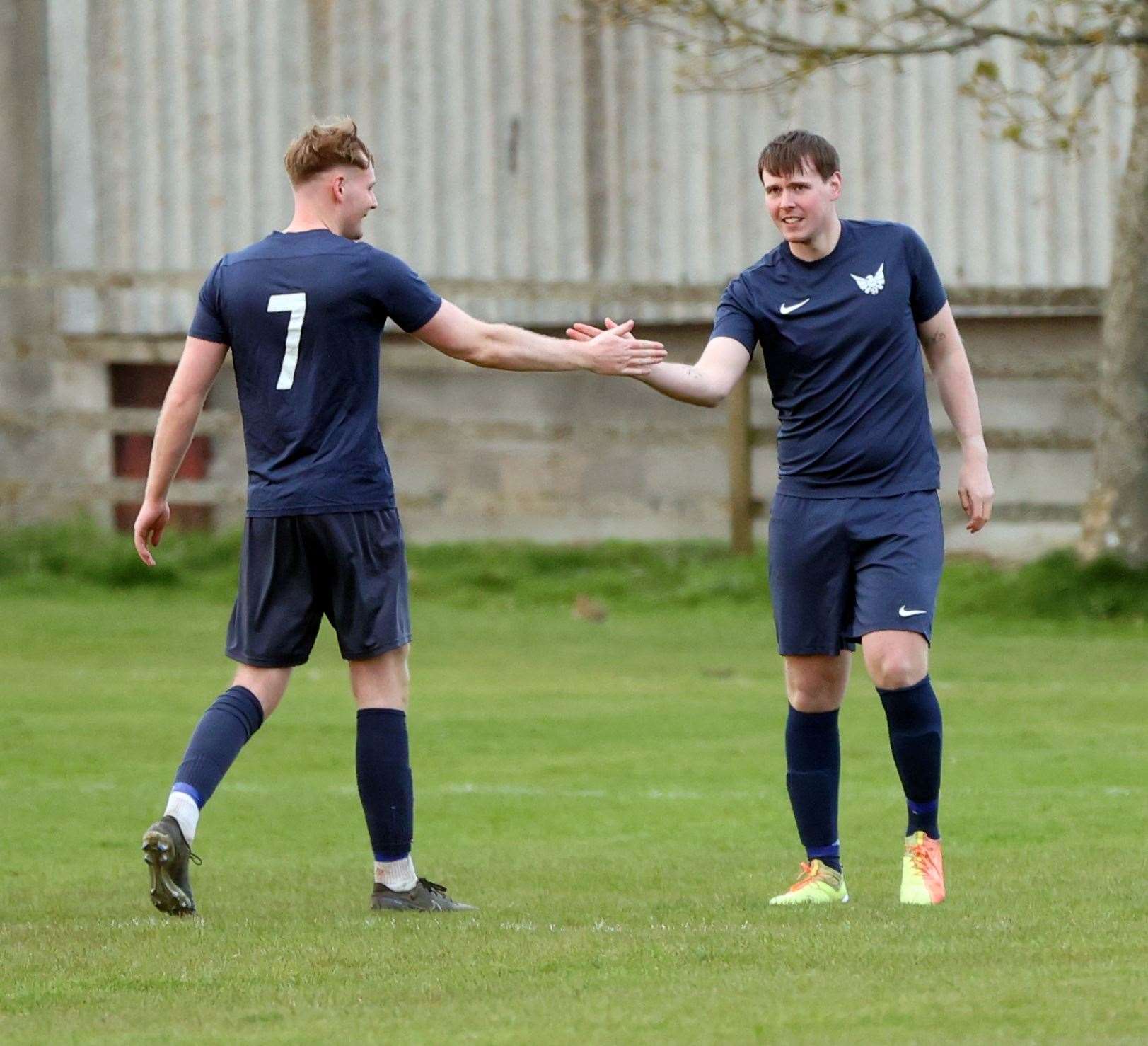 Mark Webster (right) is congratulated by Ryan Sutherland Jnr after hitting a 25-yard rocket shot into the postage-stamp corner. Picture: James Gunn