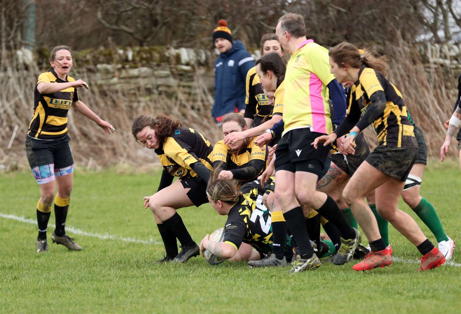 Emmy Smith scores a try despite being surrounded by Lochaber opponents. Picture: James Gunn