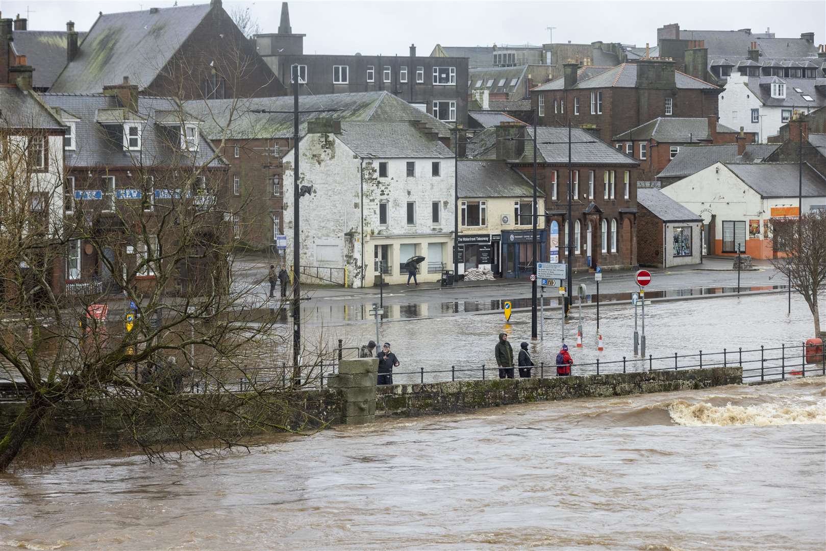 The River Nith burst its banks in Dumfries, flooding the nearby roads (Robert Perry/PA)