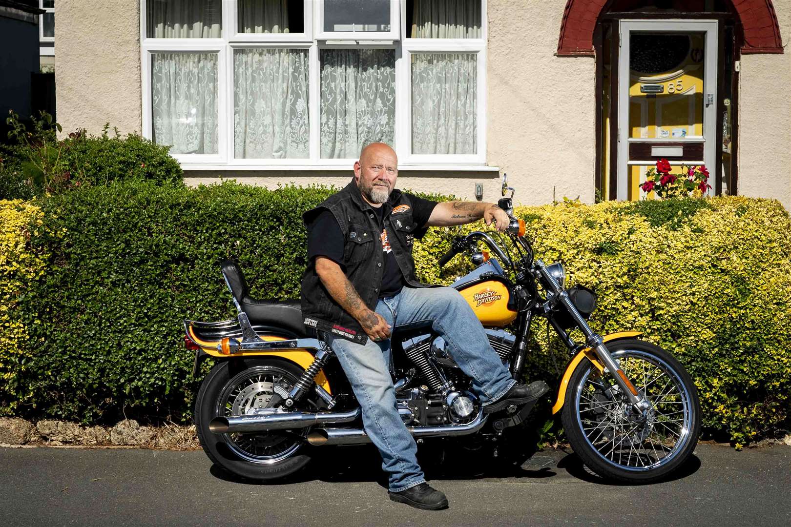 Trevor Manlow with his 2000 Harley Davidson Dyna Wide Glide (Jordan Pettitt/PA)