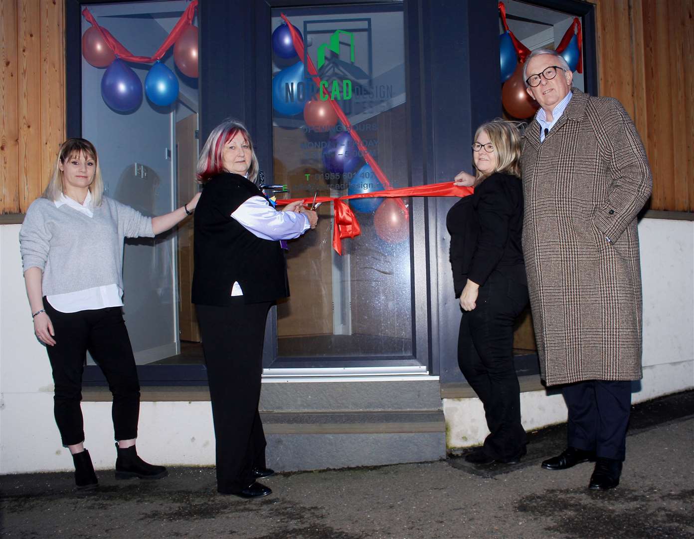 Councillor Jan McEwan cutting the ribbon to officially open the Liberal Democrat constituency office in Wick. Looking on are Jamie Stone and his constituency support manager Audrey John (left) and case officer Julie Calder. Picture: Alan Hendry