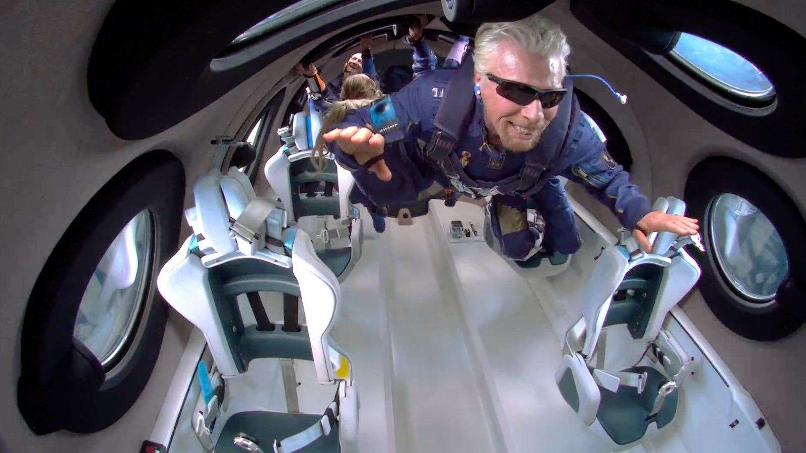 Richard Branson experiences zero gravity in space.