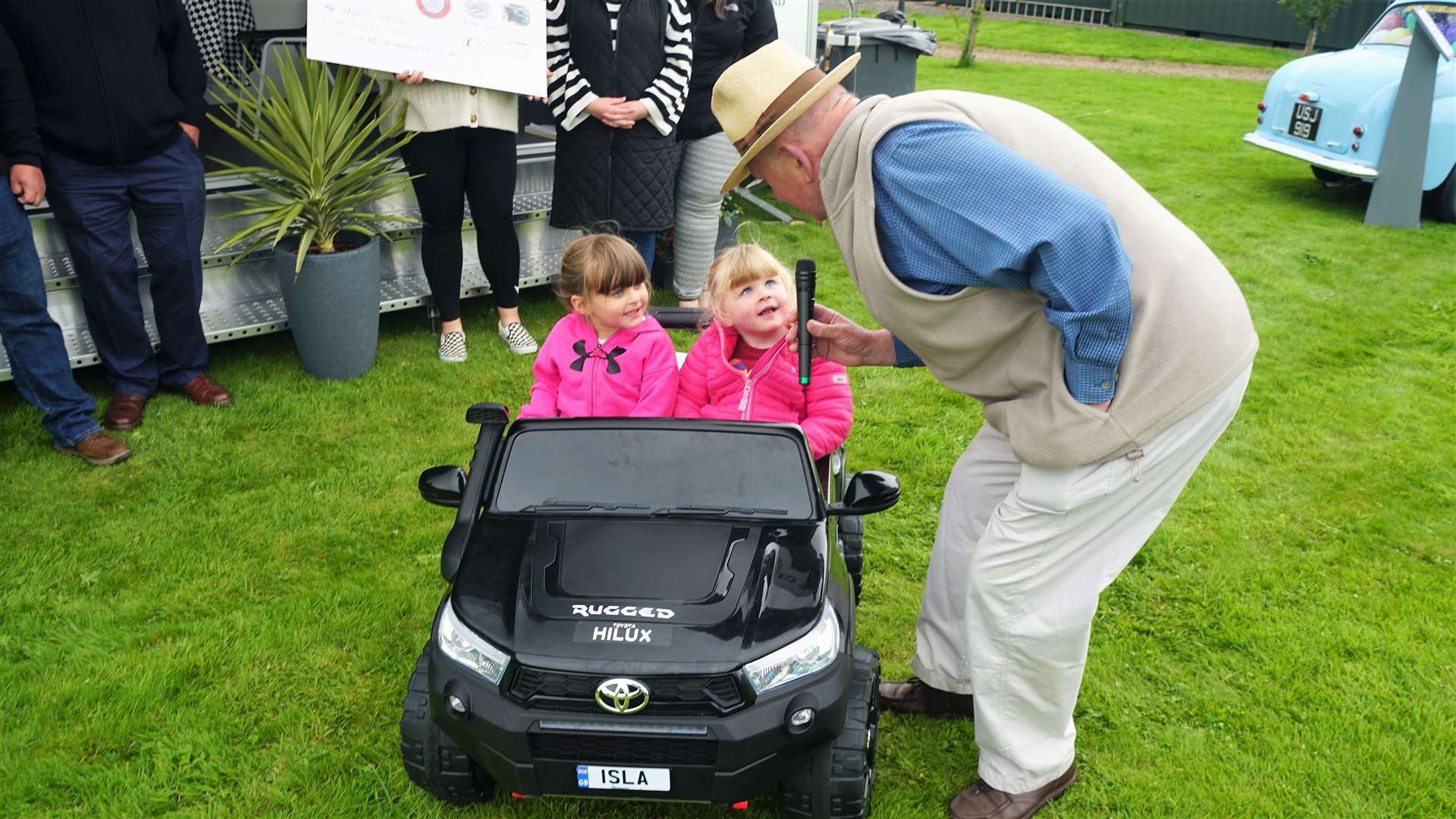 Tony Hagon, compere at the event, interviews two young drivers Isla Green and Isla Campbell. Picture: DGS