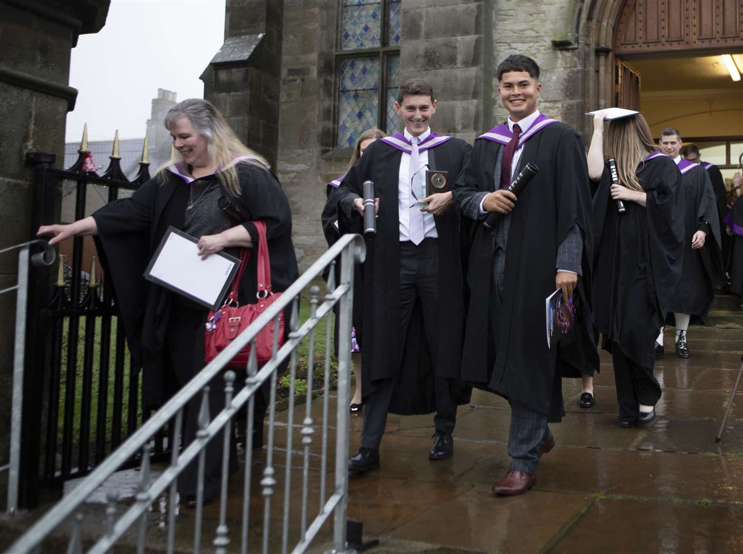 Graduates leaving the church.