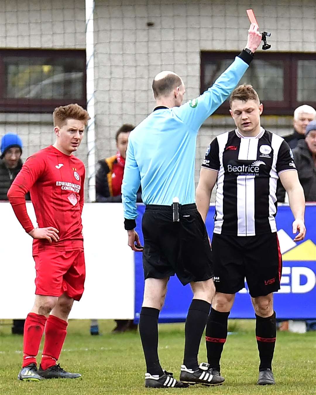 Referee Scott Leslie shows the red card to Jack Halliday after his foul on Greg Morrison. Picture: Mel Roger