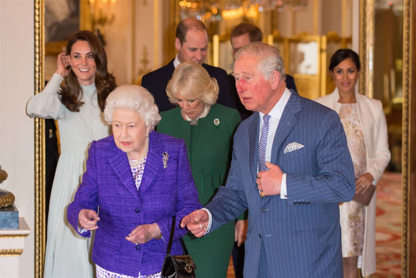 Meghan with the royal family including the Queen at a reception at Buckingham Palace to mark the fiftieth anniversary of the investiture of the Prince of Wales (Dominic Lipinski/PA)