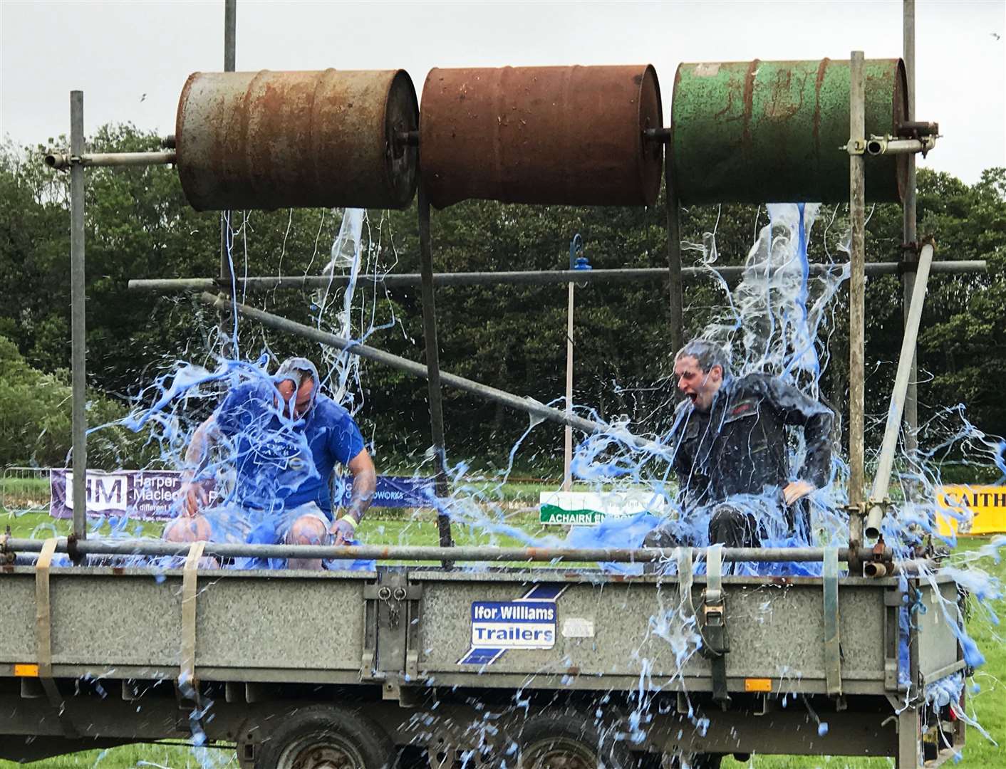 Getting a drenching in the YFC charity gunge event are John Anderson (left) and James Gunn. The young farmers raised nearly £900 for Crohn’s and Colitis UK. Picture: Jean Gunn