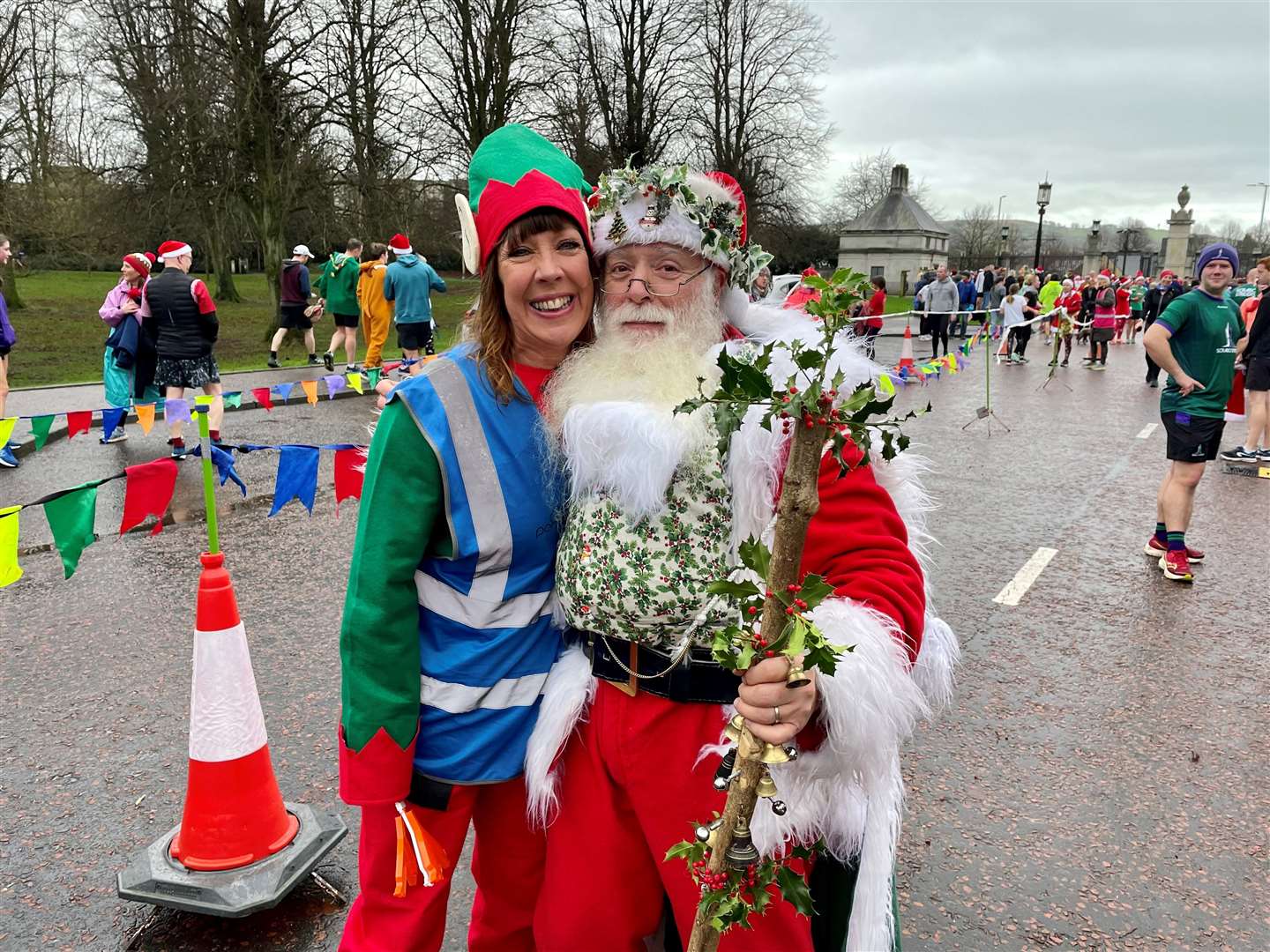 Race director Marianne Hood and Jimmy McNeilly dressed as Santa at the festive-themed Christmas Day Parkrun at Stormont in Belfast (PA)