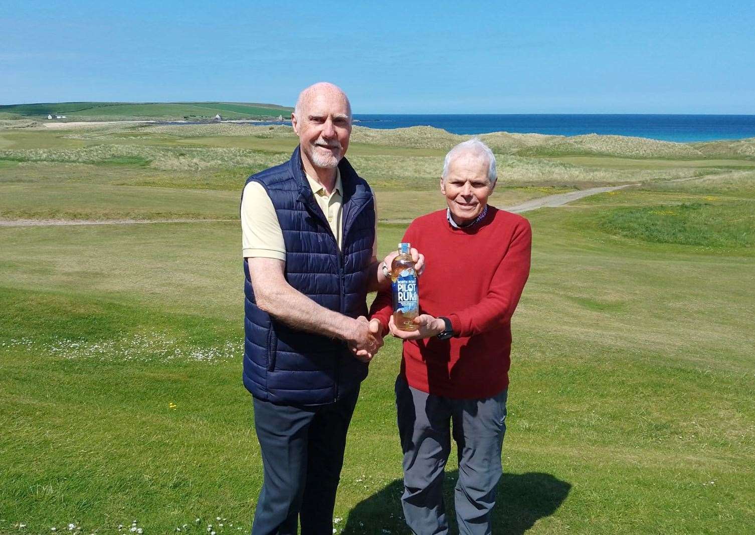 Pete Barker (left), winner of the nearest-the-pin prize during the latest round of the North Point Distillery Senior Stableford competition, with Sandy Chisholm, senior section convener.