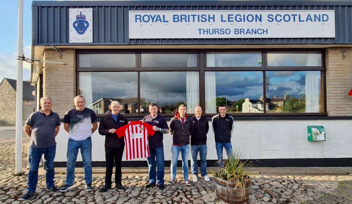 Committee members outside the Royal British Legion club with John McGeachie (third from left), operations manager of CS Drilling Services, holding one of the shirts. From left: Allan Smith, Albert McIvor, John McGeachie (CS Drilling Services), Brian Davidson, David Bain, Gavin Manson and Alistair Gunn.