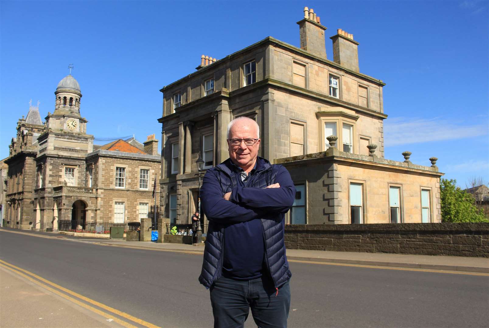 Peter Gunn in Bridge Street, Wick, with the former RBS in the background. It is the location for the town's new banking hub. Picture: Alan Hendry