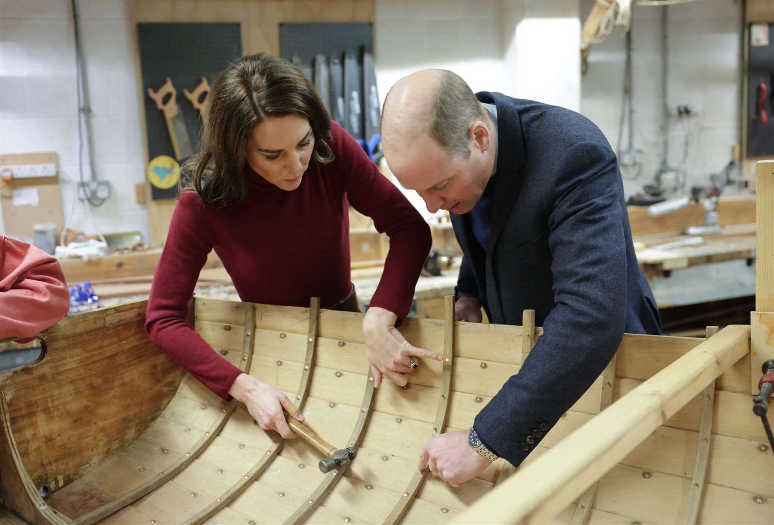 In February the Prince and Princess of Wales, known as the Duke and Duchess of Cornwall while in Cornwall, helped refurbish a boat during a visit to the National Maritime Museum Cornwall in Falmouth (Chris Jackson/PA)