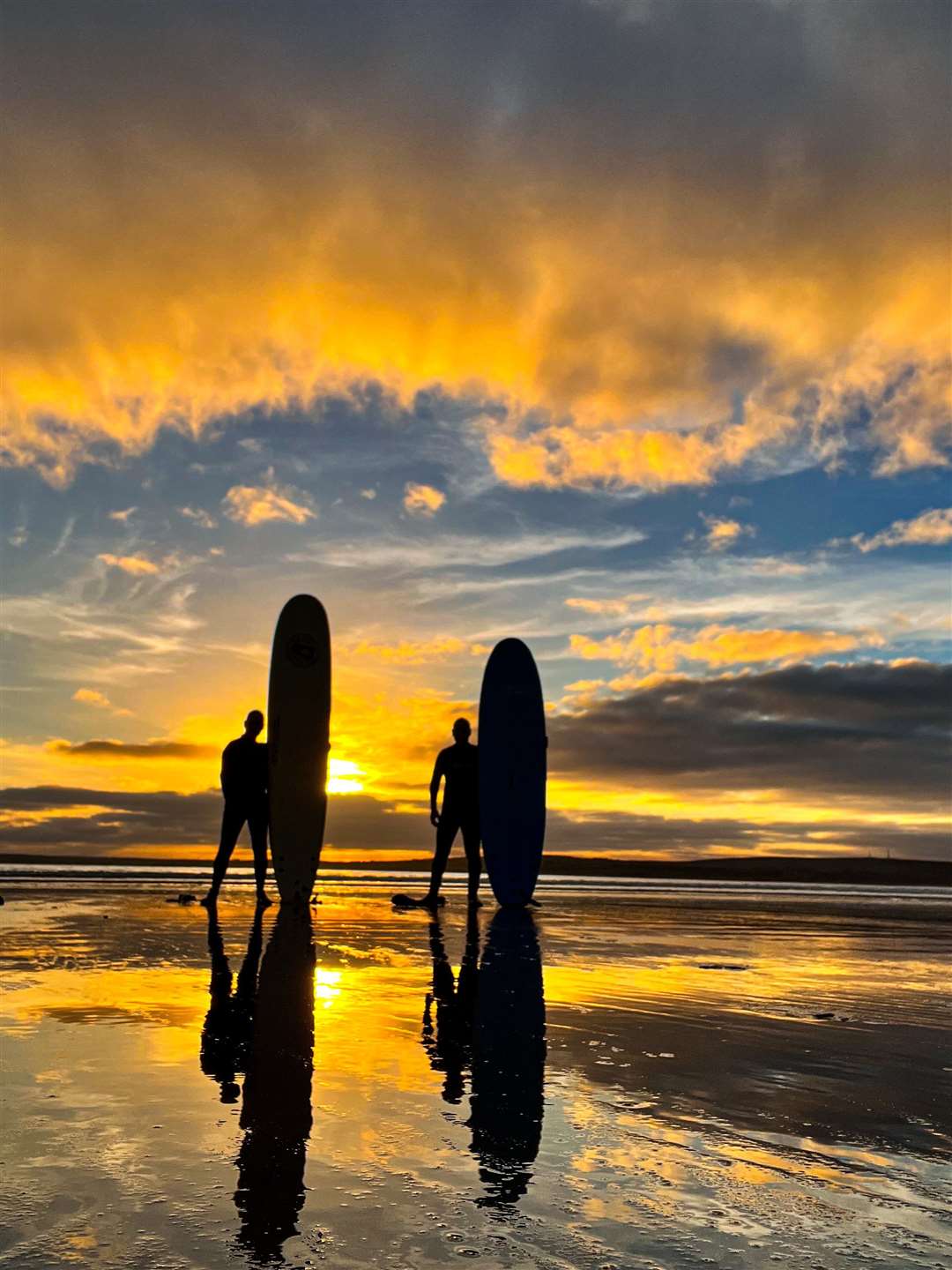 Paul Steven sent this dramatic image of surfers at Dunnet beach.
