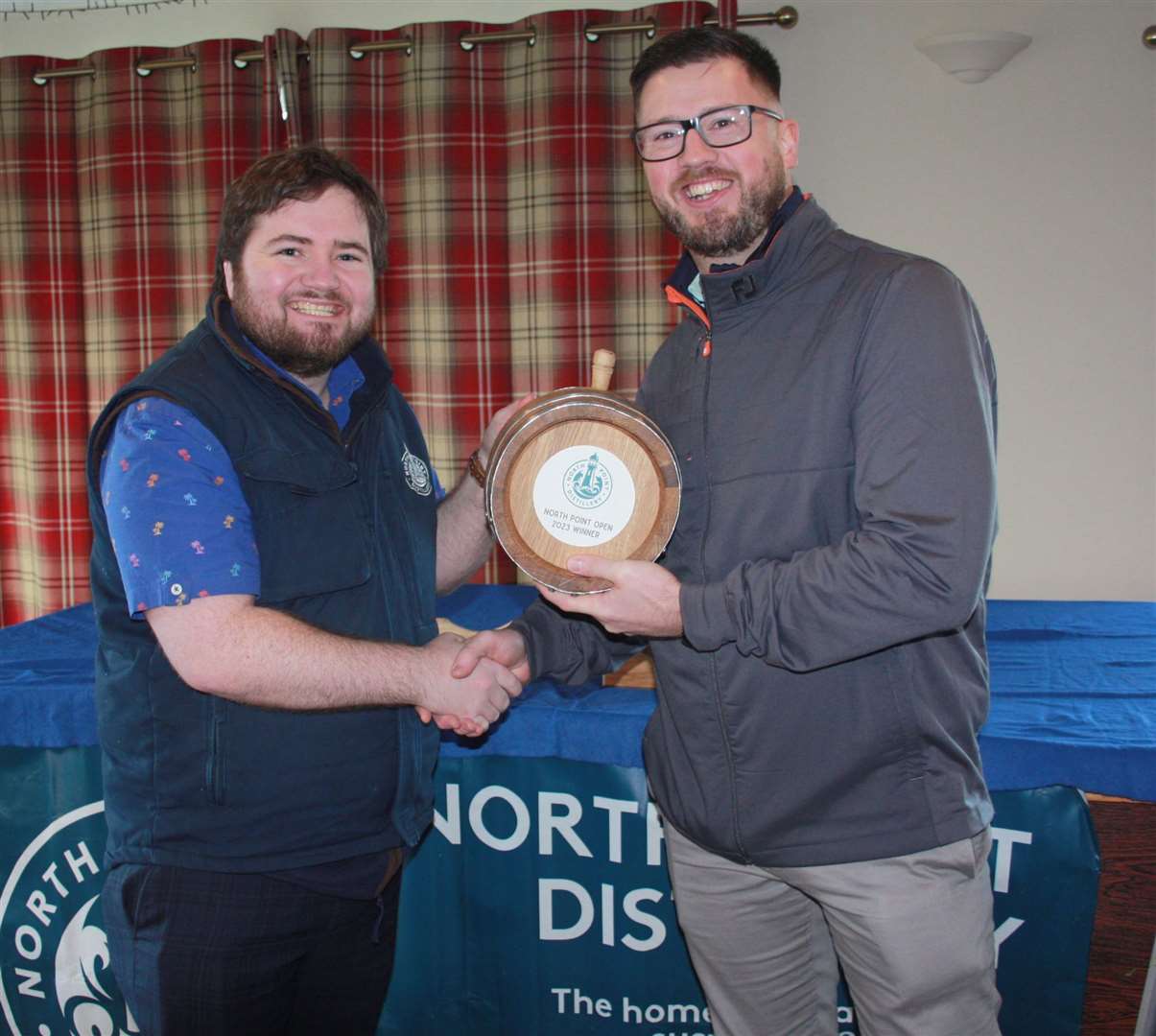 Bryan Suttar (right) of Thurso Golf Club receiving the scratch prize for the recent North Point Distillery Open from Struan Mackie, co-founder of North Point Distillery.