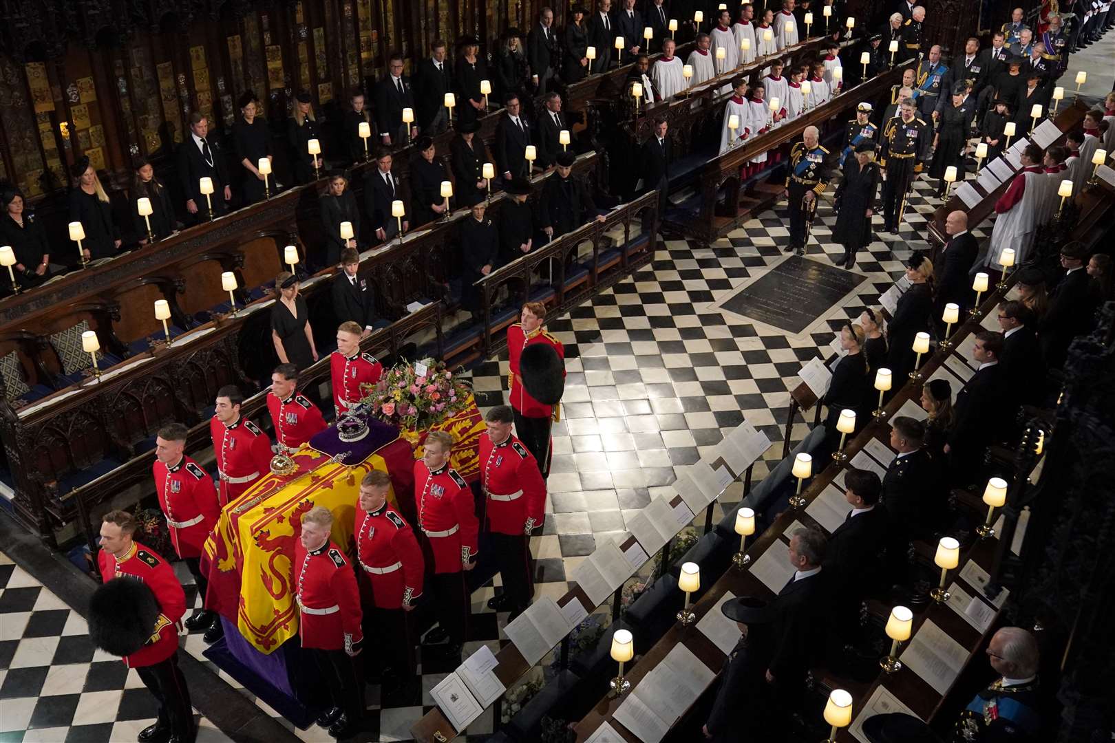 The Queen’s coffin is carried by the bearer party into the committal service at St George’s Chapel in September (Victoria Jones/PA)
