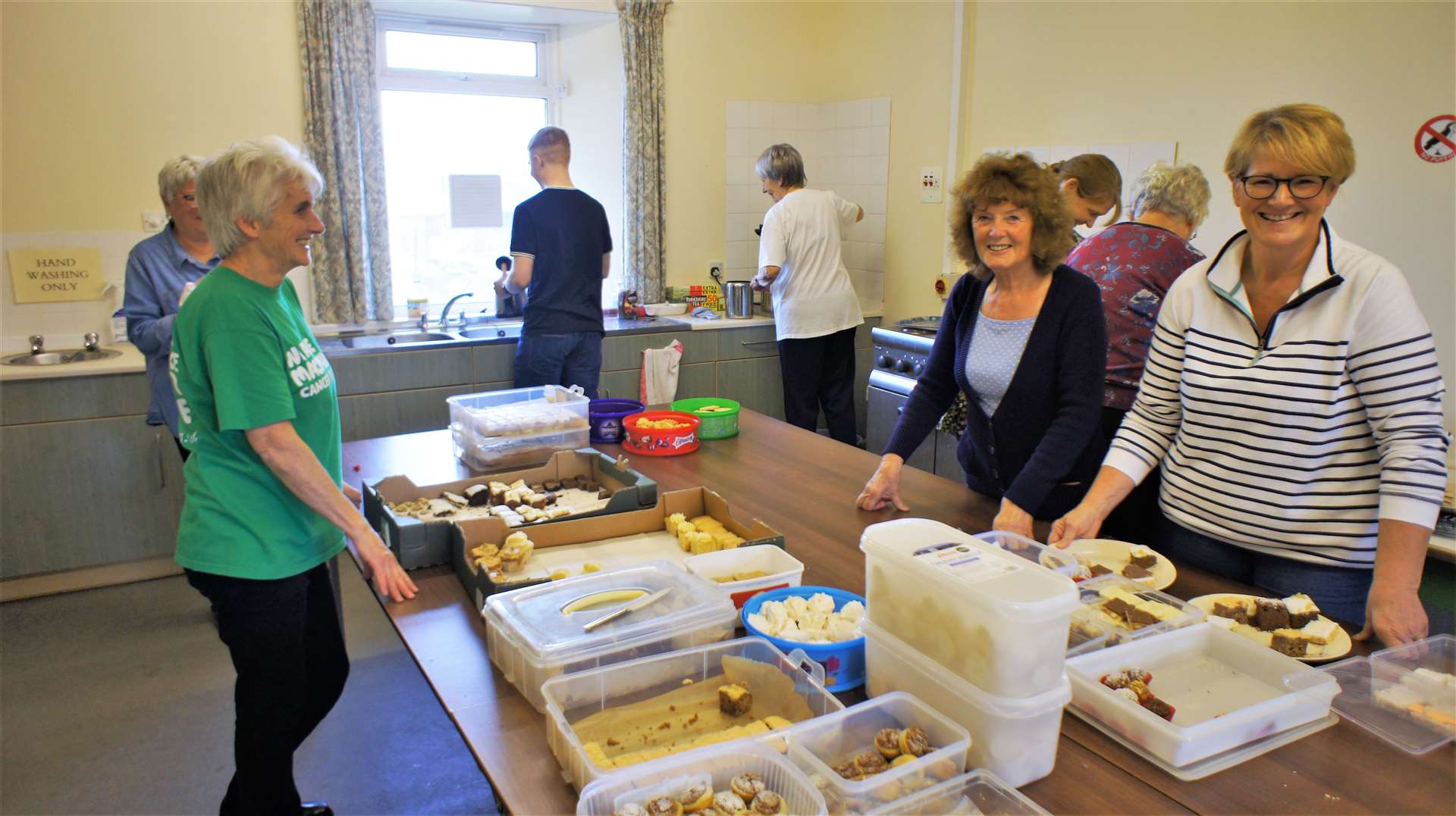 Busy in the kitchen at the Macmillan coffee morning event in Watten Village Hall. Picture: DGS