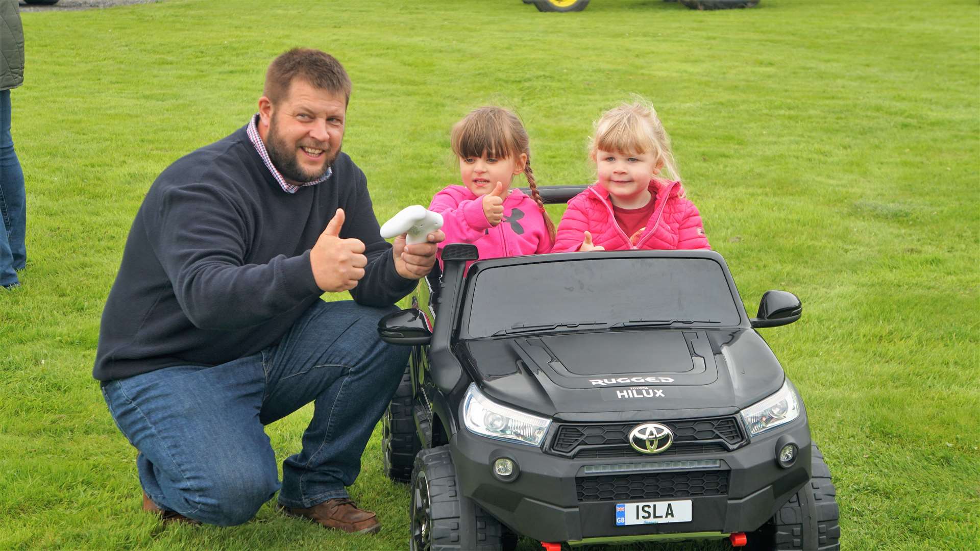Vice chair of the vintage vehicle club, James Green, with his daughter Isla and her friend who is also called Isla. Picture: DGS