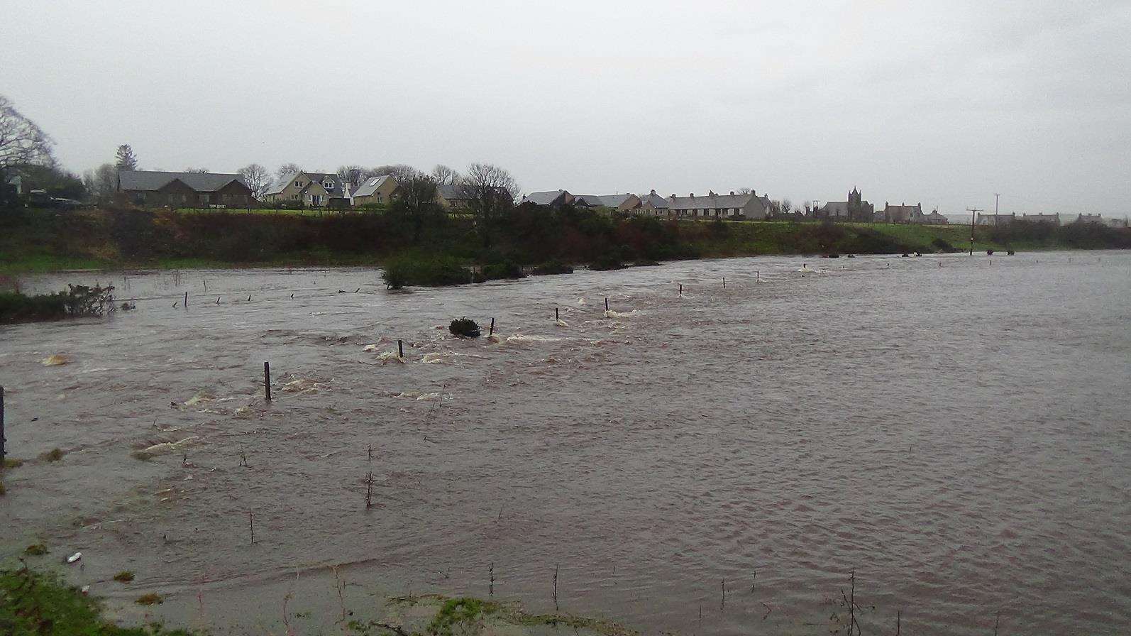 Watten was surrounded by water after the river burst its banks flooding fields. Photo: Will Clark